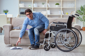 Young student on wheelchair in disability concept