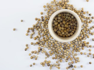 white peppers on the white background.