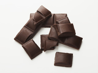 Bar of dark chocolate isolated on white