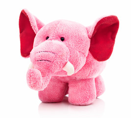 Plush pink elephant for little kids isolated on the white background with shadow reflection. Front view of soft pink animal toy for small kids for playing. Stuffed pink elephant with red ears