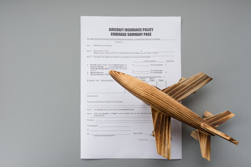 aircraft insurance policy coverage summary and an airplane model concept of travel insurance