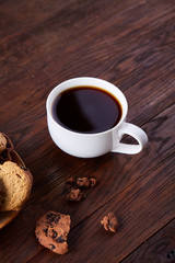 Breakfast background with mug of fresh coffee, homemade oatmeal cookies, grind coffee