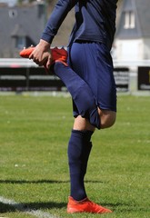 Fototapeta premium séance d'étirement au football