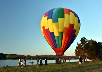 Canberra, Australia - March 11, 2018. Big colourful hot air balloon landed at Lake Burley Griffin,...