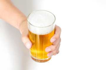 Hand of a man holding Cold beer glass with foam On a white background