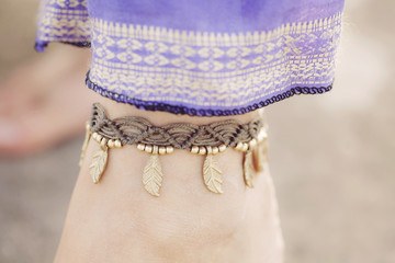 Female ankle with gypsy bracelet