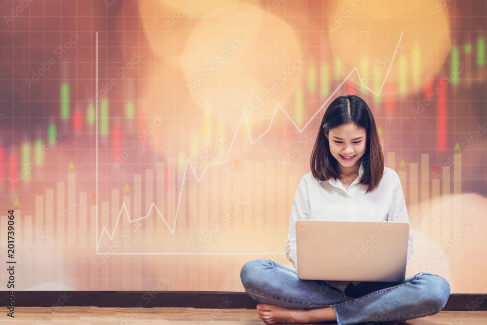 Poster woman sitting using laptop and show trading graph with the stock exchange trading graph for backgrou