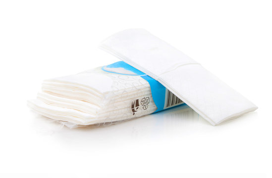 Packet of tissues isolated on the white background. Hygienic tissues for disposable usage. Napkins easily recyclable in plastic packet with bar code. Ten tissues in the packet on white background.