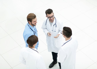 smiling group of doctors discussing