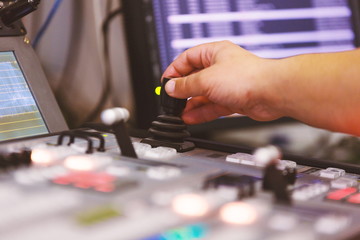 TV editor working at  television broadcast studio desk station