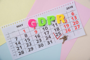 General data protection regulation on a paper background and a calendar with the date May 25, 2018