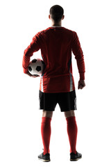 Fototapeta na wymiar Rear view of silhouette of young football player isolated on white background