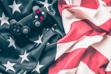 joystick on red and white stripes and white stars on blue. Patriotic mood. American flag. celebration of independence day on July 4th.