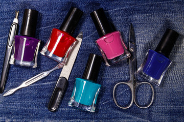 Basic set of manicure tools on jeans background