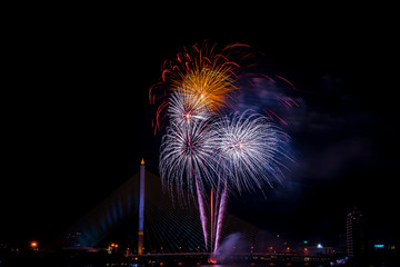 Beautiful colorful firework display for celebration happy new year and merry christmas in the night sky, bangkok city, thailand