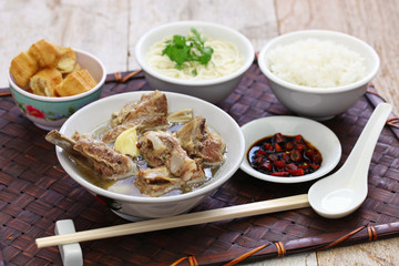 singare bak kut teh, spicy pork rib soup isolated on white background © uckyo