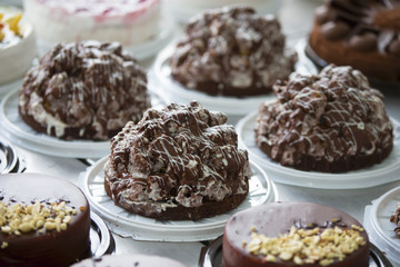 Cake and baking line.Industrial line of cakes. Many beautiful cakes on the table.Multicolored culinary products