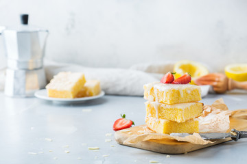 Homemade lemon polenta cookie bars with white icing