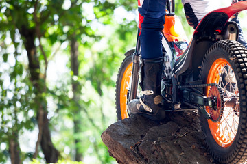 Trials motorcycle while competition in nature park, close up shot