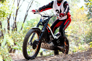 Trials motorcycle while competition in nature park, close up shot