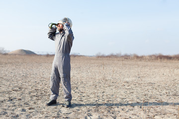 Fototapeta premium combat pilot waiting for rescue in desert area