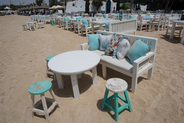 Seafront cafe with tables and chairs