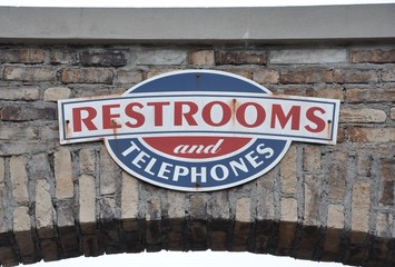 Obraz premium Restrooms and telephones signs