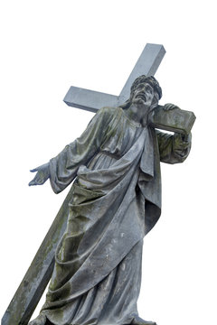 Ancient statue of the crucifixion of Jesus Christ as a symbol of God's love. Sculpture on white background.