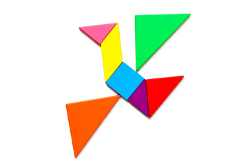 Color wood tangram puzzle in flying bird shape on white background