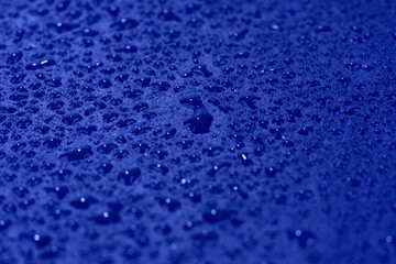 Water drops on blue background. Blue abstract background