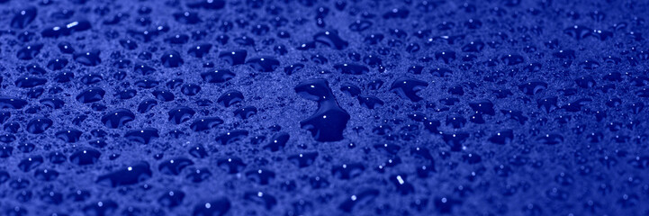 Water drops on blue background. Blue abstract background