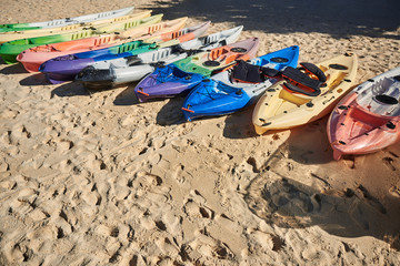 Group of Kayaks on the beach sand