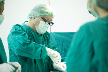 The surgery team working together at the operating room in the hospital.