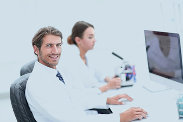 Fototapeta premium Young male technician working on computer in laboratory