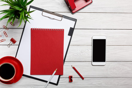white table boards folder red notepad cup morning coffee clock paper clip office office