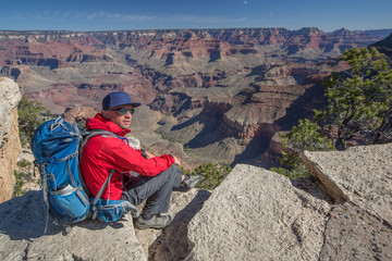 Fototapeta premium A hiker in the Grand Canyon National Park, South Rim, Arizona, USA