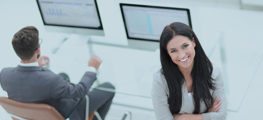 Naklejka premium successful business woman on the background of a modern workplace