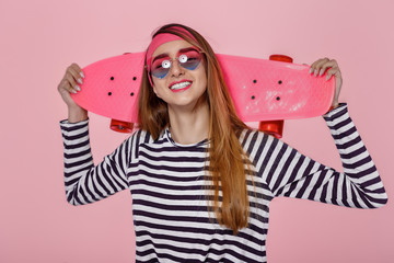 beautiful woman with skate in studio