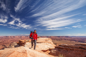 Fototapeta premium Hiker in Canyonlands National park in Utah, USA