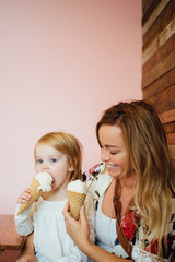 Mother and child eating ice cream together