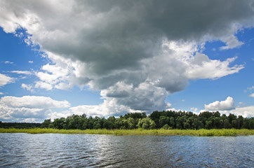 The lake is surrounded by trees along the banks