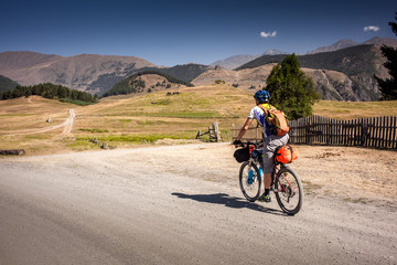 Obraz premium Mountain biker is travelling in the highlands of Tusheti region, Georgia