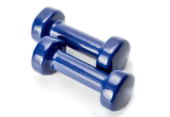 Small blue dumbbells, isolated in white background. Sports projectile for exercise.