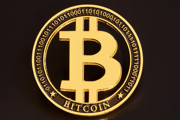 Gold bitcoin coin stacked against a dark background close-up. Bitcoin cryptocurrency. Bitcoin crypto-currency. Anonymous. BTC                            