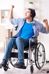 Disabled man listening to music in wheelchair