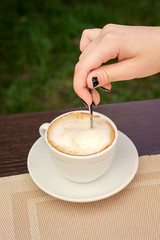 Young girl prepares  morning coffee,  useful and tasty drink_