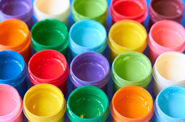Many jars with colored gouache.