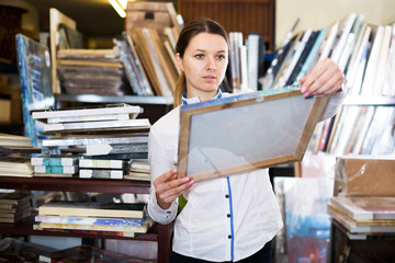 Woman buying wall picture