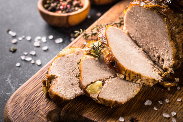 Roast pork meat with spices and herbs.  Top view.