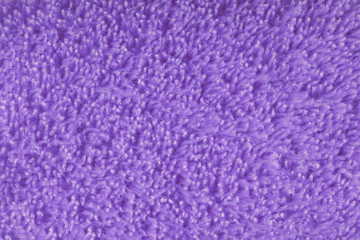Fototapeta na wymiar Violet texture of soft fluffy fleece with long pile
